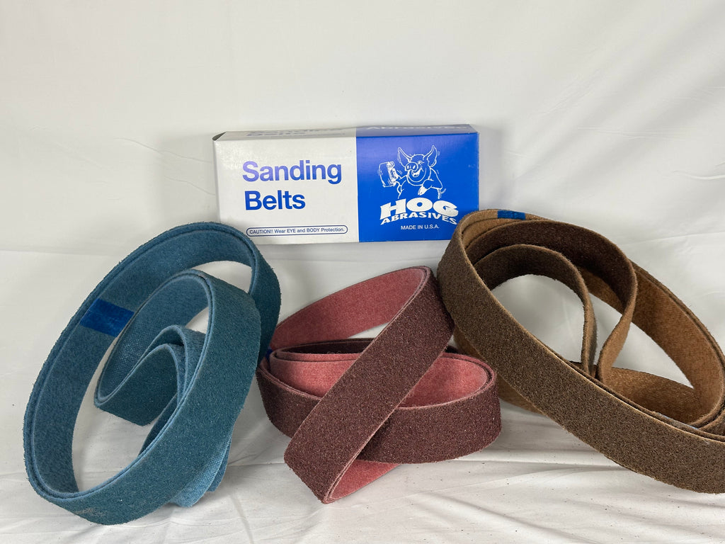 2" x 72" Hog Brand Scotch-Brite Non-Woven Belts with various colors.