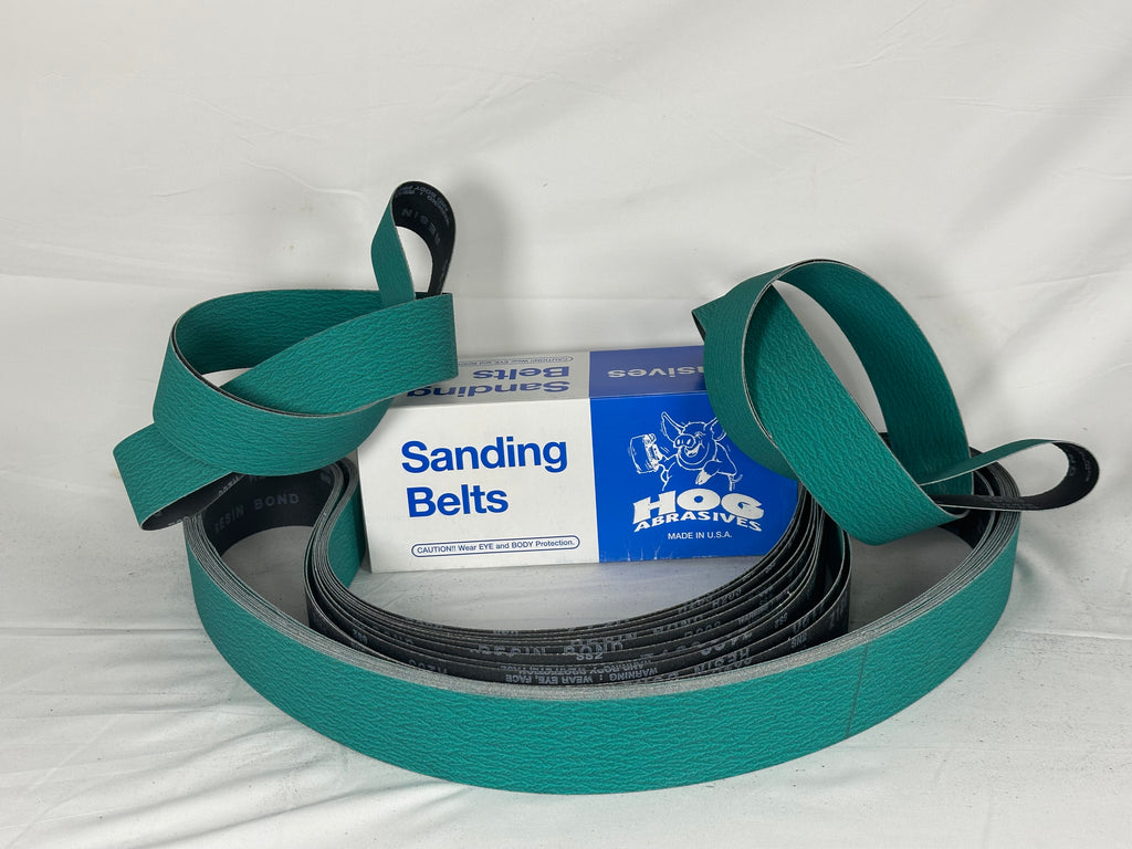 2" x 72" Hog Brand Zirconia Green Belts Plus Grinding Aid in a box with sanding belts.