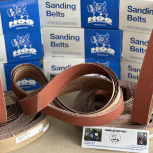 3 X 21"  HOG BRAND CERAMIC SANDING BELTS, 4 PACK in a display with Hog Brand packaging.